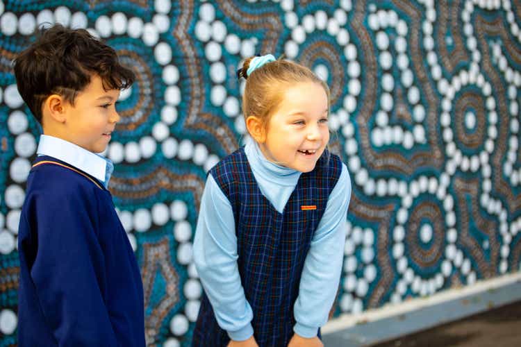 Boy and girl smiling and laughing